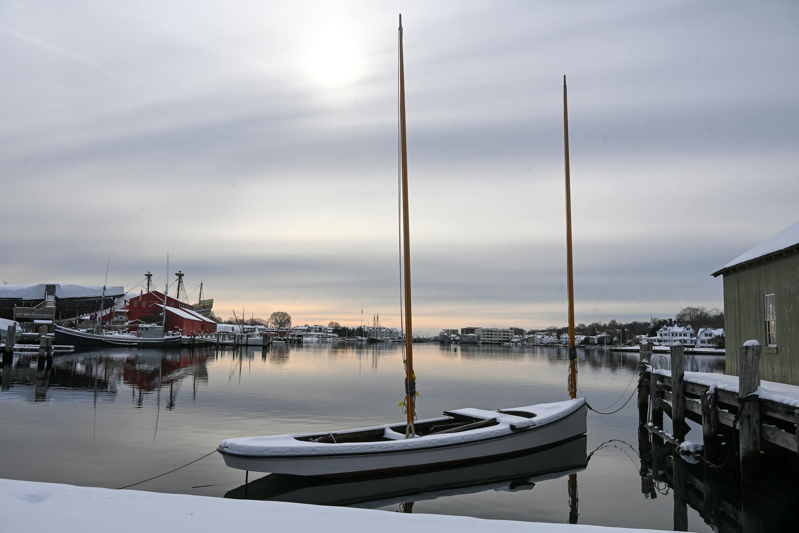 Serene winter view of boats and pier at Stonington Harbor, Connecticut.